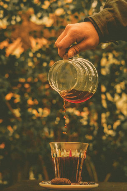 istock Pouring espresso coffee into a cup and saucer 2096879213