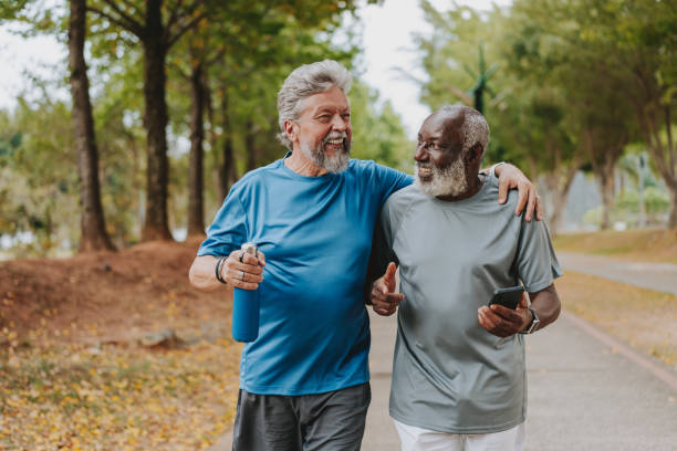 istock Two senior friends running in the public park 2096880293