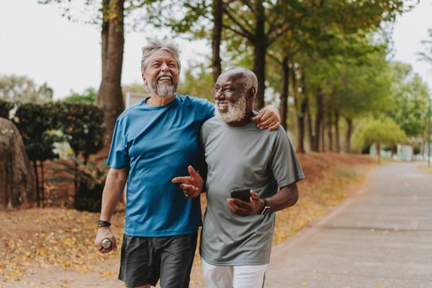 istock Two senior friends running in the public park 2096880295