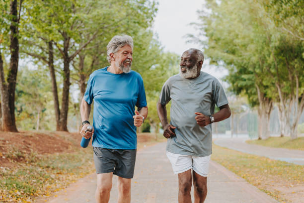 istock Two senior friends running in the public park 2096880818