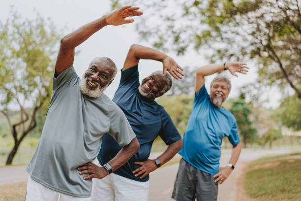 group of elderly friends exercising by stretching - avslappningsövning bildbanksfoton och bilder