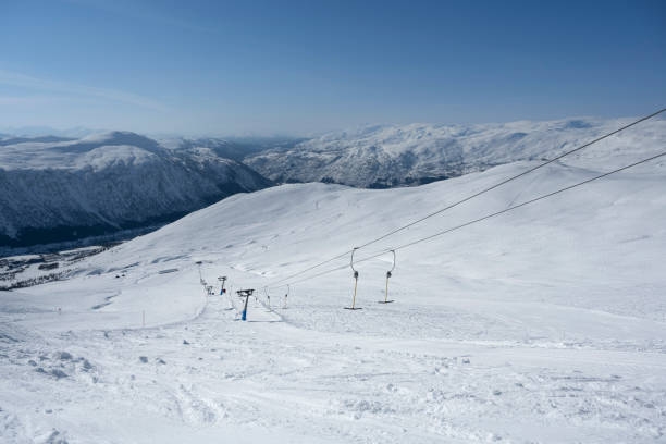 Landscape photography of skiing trail and fencing, funicular, cold weather, snowy path, ski resort, Aviemore, Cairngorms, Scotland, UK