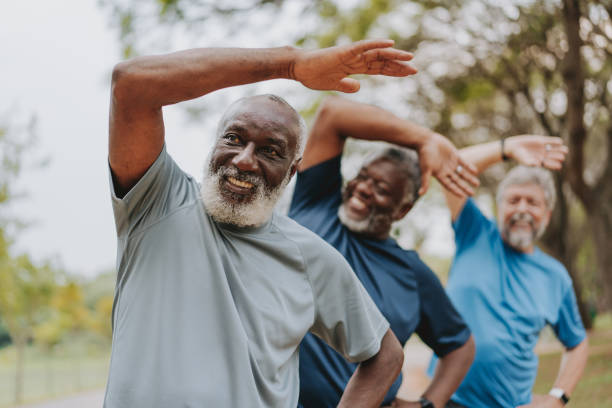 istock Group of elderly friends exercising by stretching 2096881931