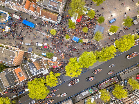 Market square Westerstraat on Koningsdag Kings day festivities in Amsterdam. Birthday of the king. Seen from helicopter.