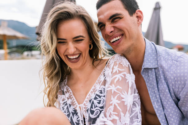 istock Happy young couple smilling and hugging on the beach. 2096906450