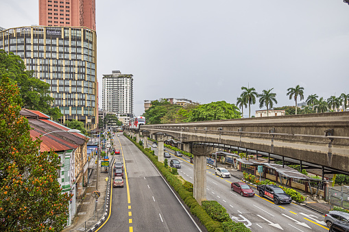 Chow Kit, Kuala Lumpur, Malaysia - January 6th 2024:  Leaving monorail train seen from the station with a view to the skyline and the streets below in the Malaysian capital