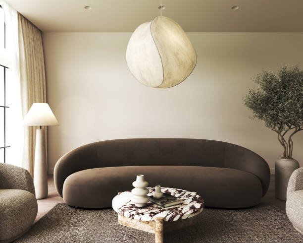 Chic living room interior with curved sofa and sculptural hanging lamp. 3d rendering