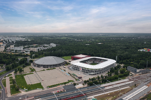 Aerial summer view of Łódź Polesie city district: Stadion Miejski im. Władysława Króla, Atlas Arena, Sport Arena Łódź (Żyliński Sport Arena), Łódź Kaliska train station in Lodz, Poland - July 2022