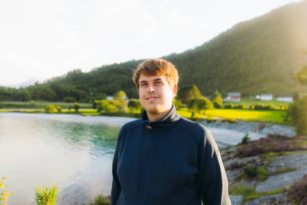 istock Happy Man Enjoying Summer Weekend by Scenic Seashore in Norway 2096948805