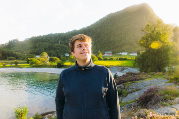 istock Happy Man Enjoying Summer Weekend by Scenic Seashore in Norway 2096957159
