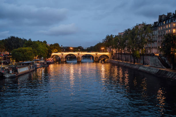 Bridge over the River Seine at night in Paris, France