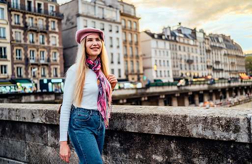 Young smiling woman enjoying a walk in Paris, France