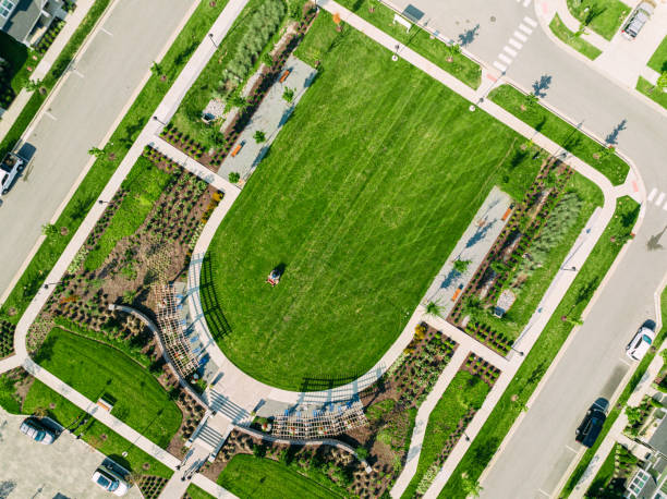 istock Elevated View of a Riding Lawnmower to Cut Grass in a Diagonal Pattern 2096985803