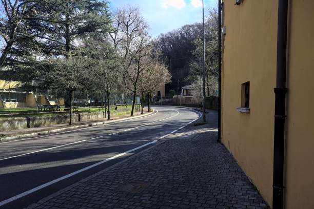 istock Street in a town next to a hill 2096986879