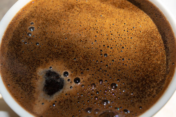 istock Freshly brewed instant coffee. Cup of black coffee, close-up. 2097001100