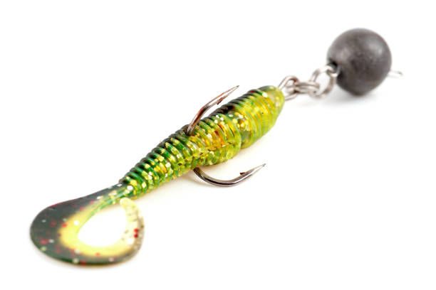 istock Soft fishing bait, moss green plastic grub, with double hook and lead sinker, isolated on white 2097002387