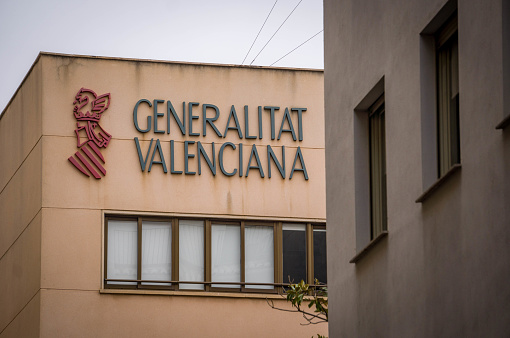 Official Logo of the Generalitat Valenciana Regional Government on the Facade of a Court Building in a street of Valencia City