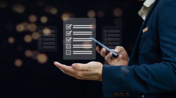 istock Business performance checklist, Business evaluation, project approval and enhancing business performance. Businessman checking mark on check box to approved documents. 2097027548