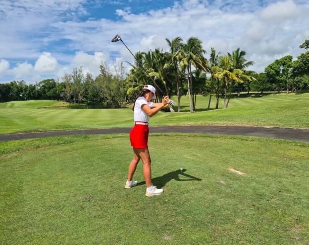 istock Person Swinging Golf Club on Course 2097030794