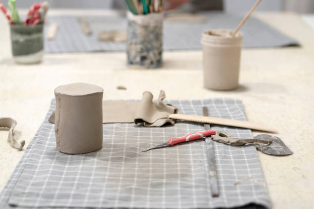 istock Close up of human hands working on clay 2097038228