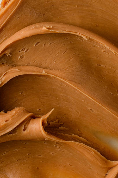 istock Delicate beige brown thick cream for delicious macarons 2097055133