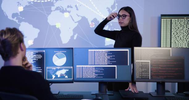 istock Smiling cyber security team working in a Cyber Security Operations Center SOC to protect systems and technologies 2097066286