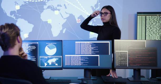 istock Focused professional cyber security team working to prevent security threats, find vulnerability and solve incidents 2097067339