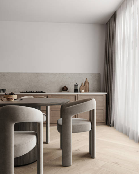 istock Modern dining area with curved chairs and natural wood table under sculptural pendant lights 2097069975
