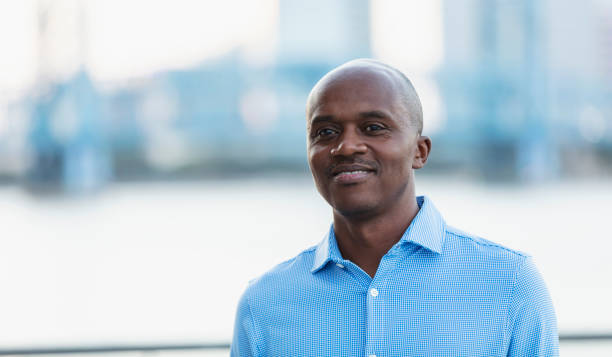 istock African-American man standing on city waterfront 2097101358
