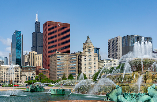 A portion of the Chicago skyline as seen from the Buckingham Fountain on a summer day.