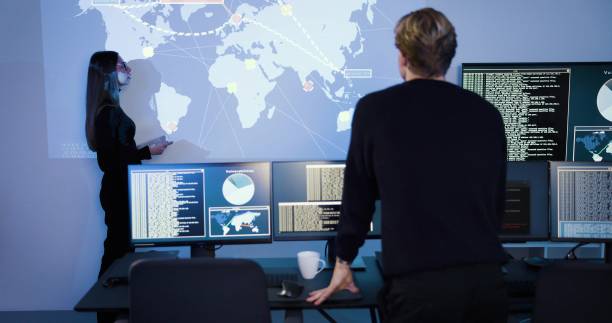 istock Focused professional cyber security team working to prevent security threats, find vulnerability and solve incidents 2097118524