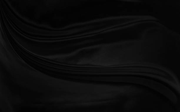 istock Black gray satin dark fabric texture luxurious shiny that is abstract silk cloth background with patterns soft waves blur beautiful. 2097126323
