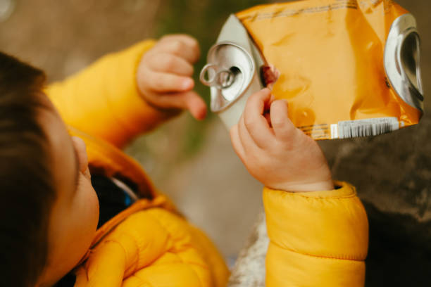 istock The boy holding a can stock photo 2097127381