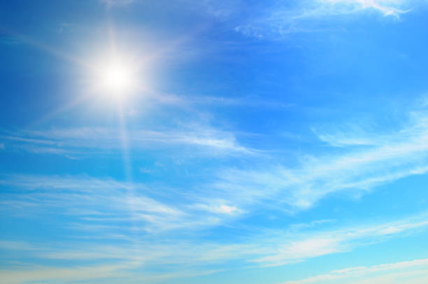 istock cumulus clouds and a bright sun in the blue sky. 2097150759
