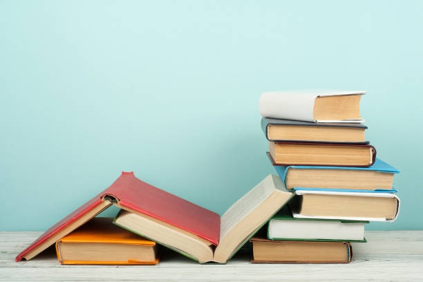 istock Open book, hardback colorful books on wooden table. Back to school. Copy space for text. Education business concept. 2097164462