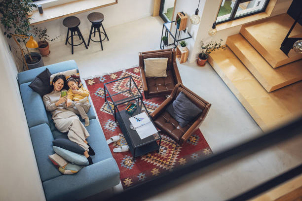 istock Mom and daughter relaxing at home 2097185031