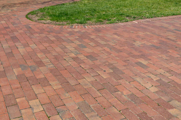 istock Background of brick pathway with loop of green grass, creative copy space 2097201430