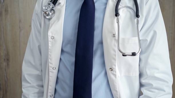 istock Professional doctor in white lab coat with stethoscope 2097212934