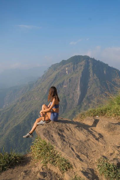 istock Young woman on top of mountain 2097216543