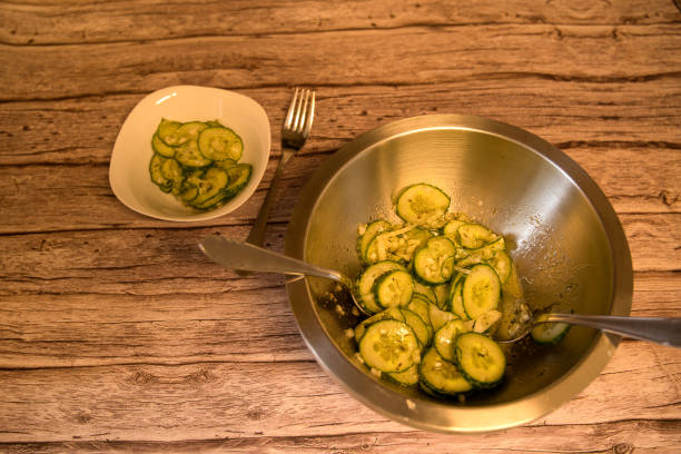 cut cucumber slices in a large and small bowl