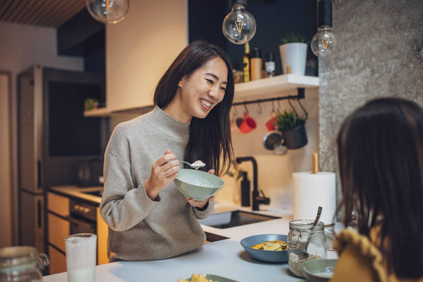 istock Mother and daughter having breakfast 2097241434