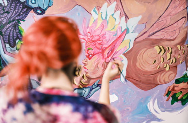istock Young Caucasian woman creating indoor mural at the gym 2097276520