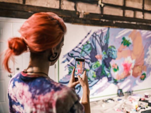 istock Young Caucasian woman creating indoor mural at the gym 2097277044