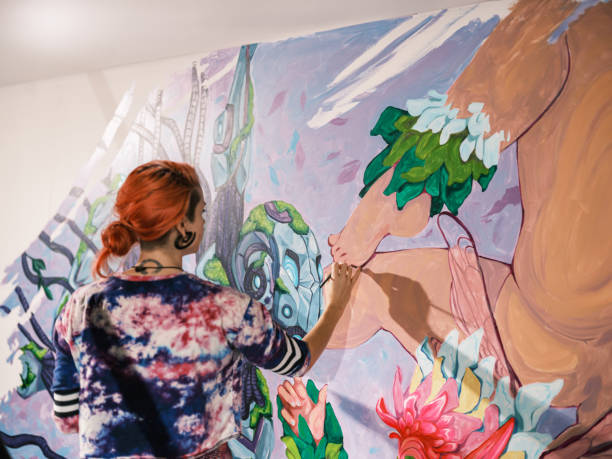 istock Young Caucasian woman creating indoor mural at the gym 2097279636