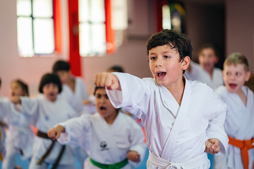 karate training of a little boy in a kimono