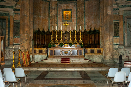 Rome, Italy - October 11, 2007: The altar at the Basilica of St. Mary and the Martyrs. The Pantheon was a temple built in 27 BC by Marcus Agrippa and rebuilt by Emperor Hadrian around 126 AD. Since the 7th century, it has been a Roman Catholic church. No people. Image shot in Ambient light.