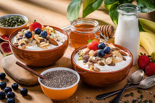 Healthy breakfast of granola, yogurt, fruits and seeds