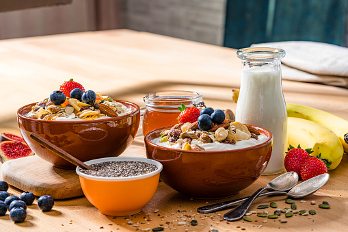Healthy eating: two granola bowls on breakfast table