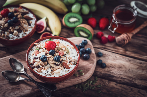 Granola, yogurt and fruits bowl for healthy meal
