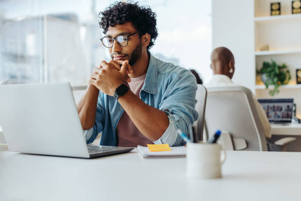 istock Happy entrepreneur working on laptop at modern office table 2097326149